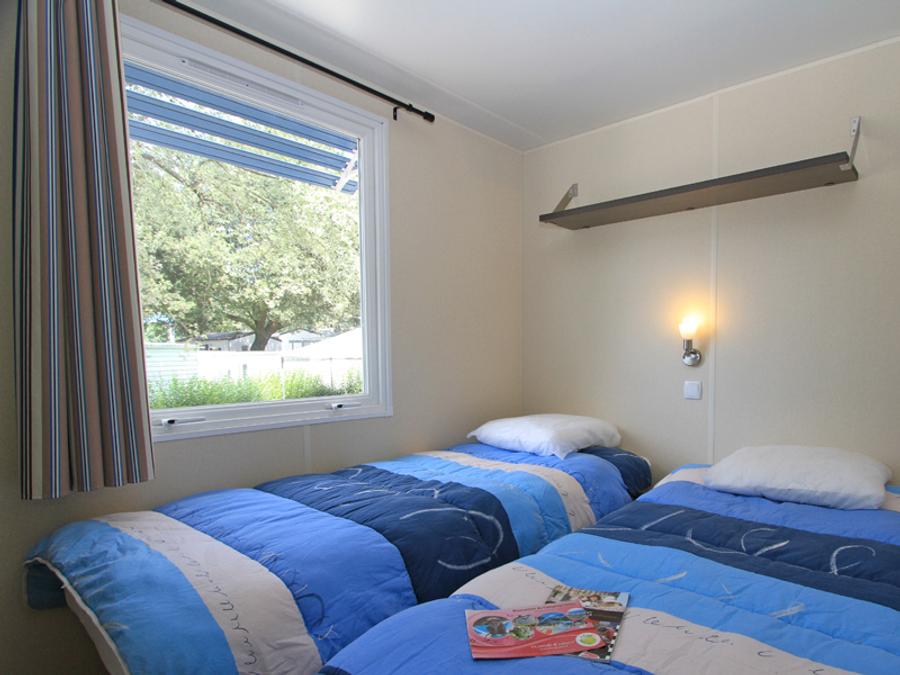 Mobilhome 4 personnes - 'Evasion Confort Eco' 29m² + 2 chambres + terrasse semi-couverte 13.5m² 7
