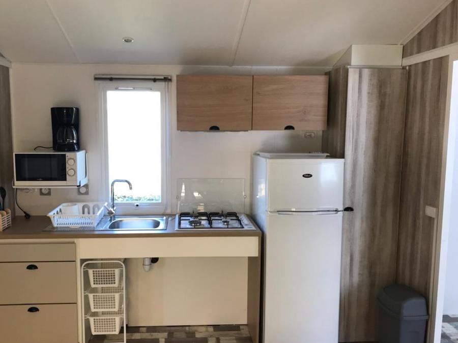 Mobilhome 4 personnes - PMR 31m² - 2 chambres - terrasse couverte (adapté pour personnes à mobilité réduite) - TV 6