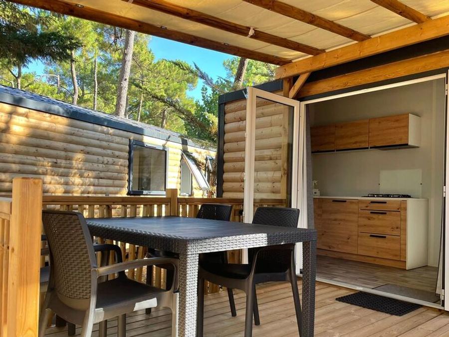 Mobilhome 4 personnes - BAHIA BOIS 29m² - 2 chambres avec une terrasse bois couverte et une terrasse solarium 1